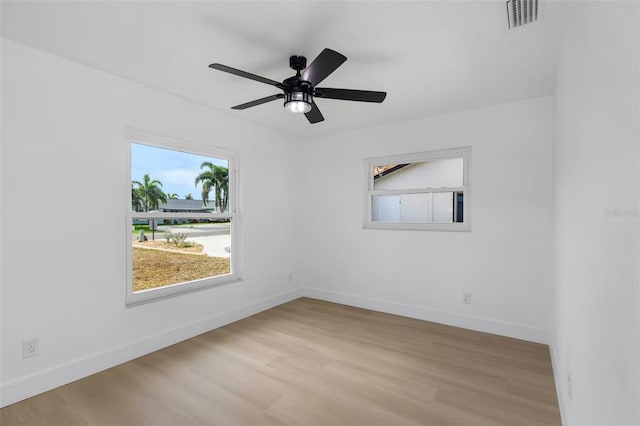 6508 Senegal Palm Way, Apollo Beach, FL 33572 - unfurnished room featuring wood finished floors, baseboards, and ceiling fan