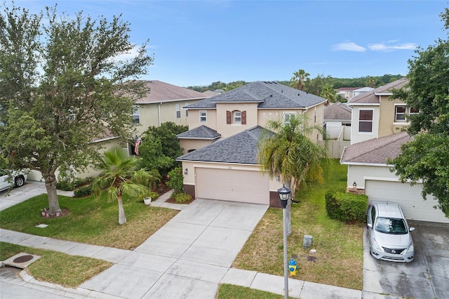 3351 Lintower Dr, Land O Lakes, FL 34638 - view of front of house with driveway, stucco siding, roof with shingles, and a residential view