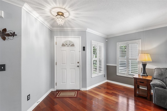 3351 Lintower Dr, Land O Lakes, FL 34638 - foyer entrance featuring hardwood / wood-style flooring, a chandelier, baseboards, ornamental molding, and a textured ceiling
