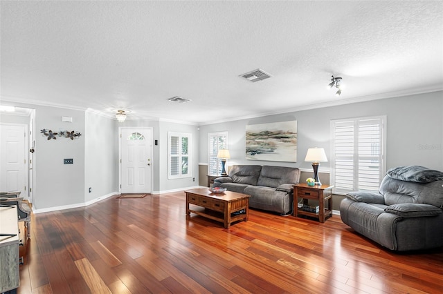 3351 Lintower Dr, Land O Lakes, FL 34638 - living room with hardwood / wood-style floors, crown molding, a textured ceiling, plenty of natural light, and baseboards