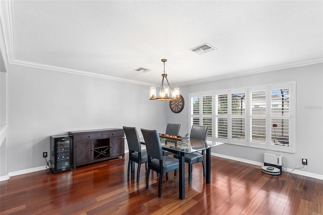 3351 Lintower Dr, Land O Lakes, FL 34638 - dining room with wine cooler, dark wood-style flooring, crown molding, a chandelier, and baseboards