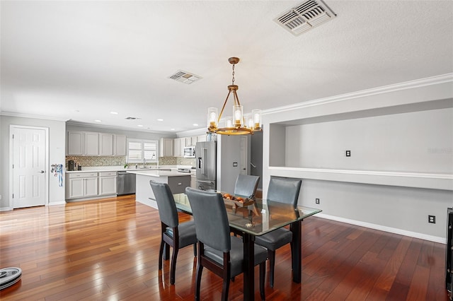 3351 Lintower Dr, Land O Lakes, FL 34638 - dining space featuring a chandelier, ornamental molding, light wood finished floors, baseboards, and recessed lighting
