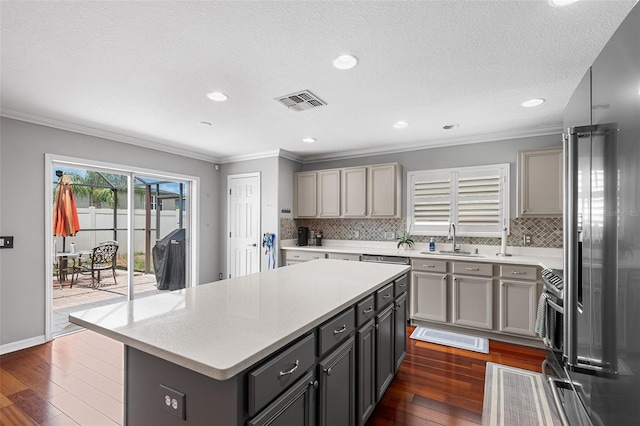 3351 Lintower Dr, Land O Lakes, FL 34638 - kitchen with a sink, gray cabinets, light countertops, crown molding, and recessed lighting