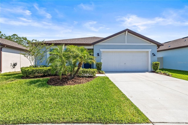 30273 Marquette Ave, Wesley Chapel, FL 33545 - single story home featuring concrete driveway, an attached garage, a front yard, and stucco siding