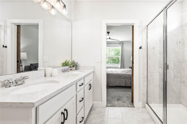 30273 Marquette Ave, Wesley Chapel, FL 33545 - full bathroom with connected bathroom, double vanity, baseboards, a stall shower, and a ceiling fan