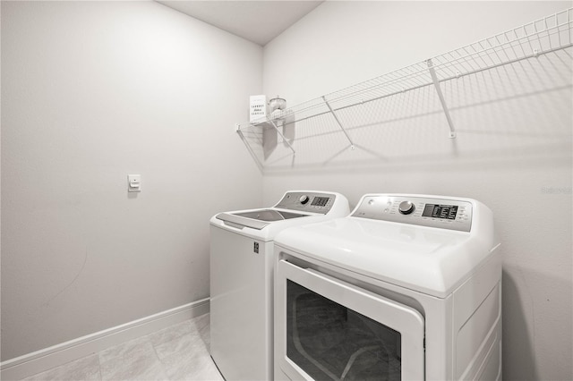 30273 Marquette Ave, Wesley Chapel, FL 33545 - washroom with washer and dryer and baseboards