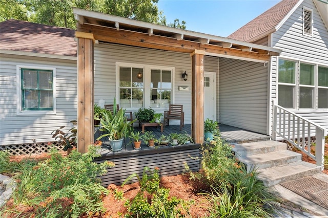 2911 N Jefferson St, Tampa, FL 33602 - view of front facade featuring covered porch and a shingled roof