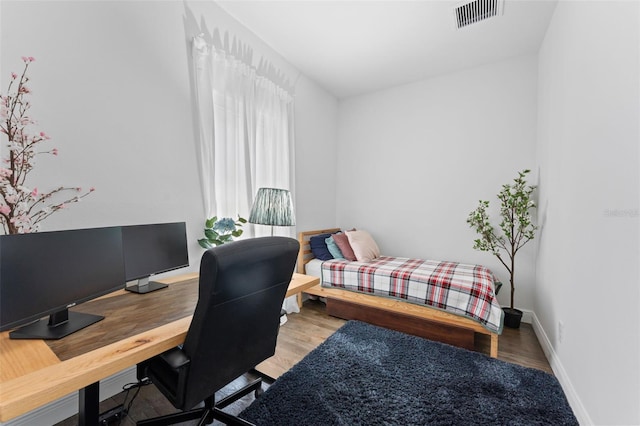 2911 N Jefferson St, Tampa, FL 33602 - bedroom with a desk, baseboards, and wood finished floors