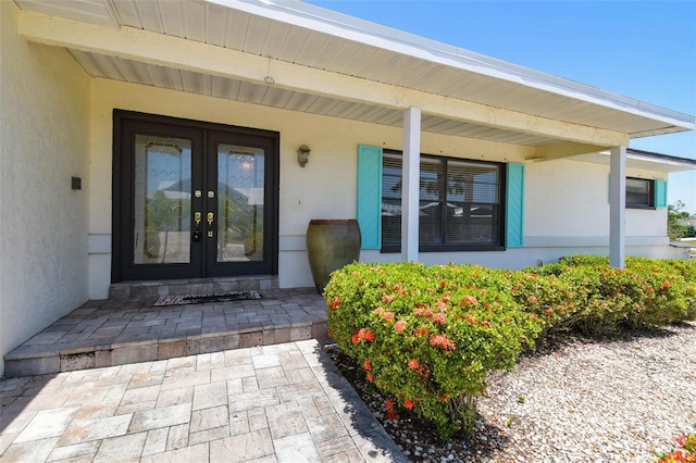 6322 Cocoa Ln, Apollo Beach, FL 33572 - doorway to property with french doors and stucco siding