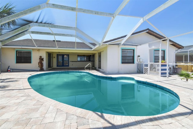 6322 Cocoa Ln, Apollo Beach, FL 33572 - swimming pool with a patio area, glass enclosure, and french doors