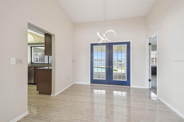 6322 Cocoa Ln, Apollo Beach, FL 33572 - entryway with french doors, a chandelier, baseboards, and light tile patterned floors