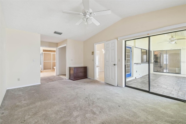 6322 Cocoa Ln, Apollo Beach, FL 33572 - unfurnished bedroom with carpet, vaulted ceiling, baseboards, ensuite bath, and a ceiling fan