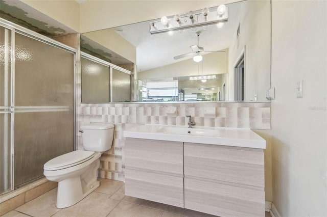 6322 Cocoa Ln, Apollo Beach, FL 33572 - bathroom featuring toilet, tile patterned flooring, ceiling fan, a shower stall, and vaulted ceiling