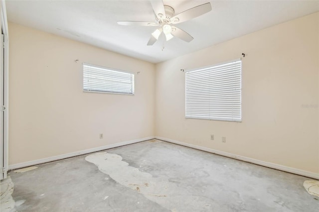 6322 Cocoa Ln, Apollo Beach, FL 33572 - spare room featuring unfinished concrete floors, baseboards, and ceiling fan