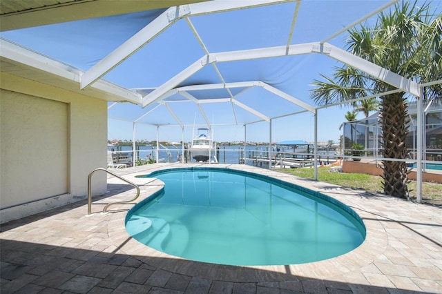 6322 Cocoa Ln, Apollo Beach, FL 33572 - swimming pool with boat lift, a dock, a patio, a lanai, and a water view