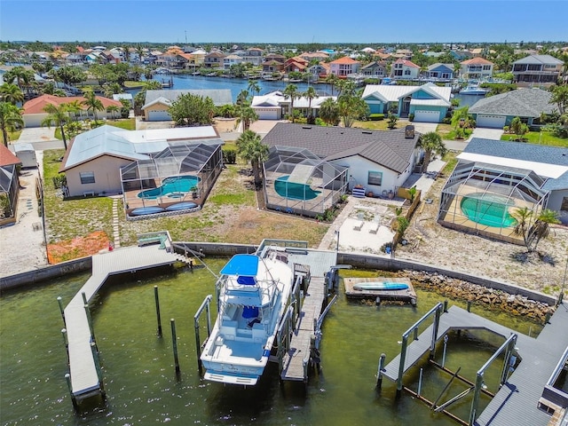 6322 Cocoa Ln, Apollo Beach, FL 33572 - aerial perspective of suburban area featuring a pool and a large body of water