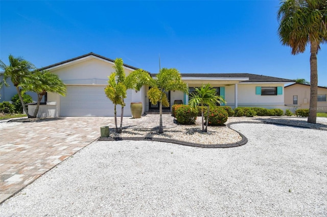 6322 Cocoa Ln, Apollo Beach, FL 33572 - ranch-style house with an attached garage, driveway, and stucco siding