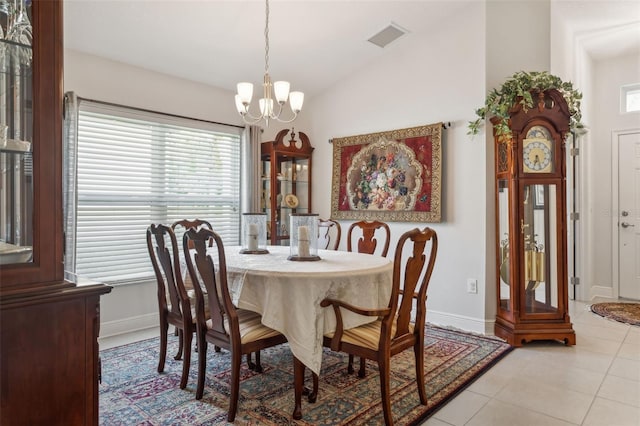 6555 Sparkling Way, Wesley Chapel, FL 33545 - dining area with a chandelier, lofted ceiling, baseboards, and light tile patterned flooring