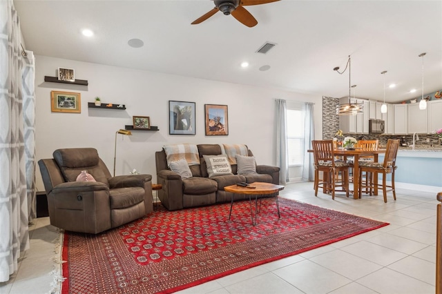 6555 Sparkling Way, Wesley Chapel, FL 33545 - living area with a ceiling fan, lofted ceiling, and light tile patterned floors