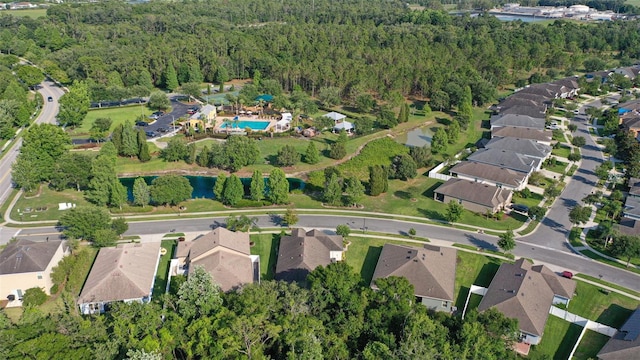 6555 Sparkling Way, Wesley Chapel, FL 33545 - aerial overview of property's location featuring a heavily wooded area, a pool, and nearby suburban area
