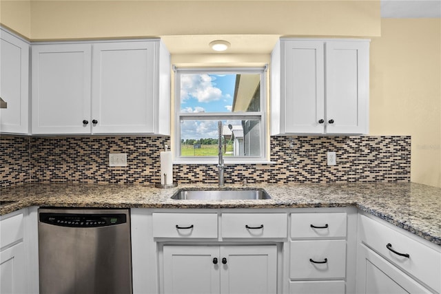 9780 Allen Rd, Lithia, FL 33547 - kitchen with stainless steel dishwasher, a sink, backsplash, and white cabinetry