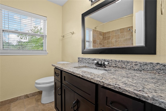 9780 Allen Rd, Lithia, FL 33547 - bathroom featuring vanity, baseboards, toilet, a shower, and stone tile flooring