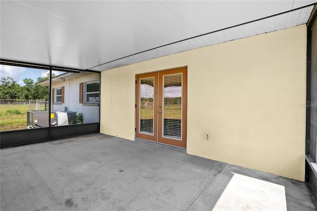 9780 Allen Rd, Lithia, FL 33547 - unfurnished sunroom featuring french doors