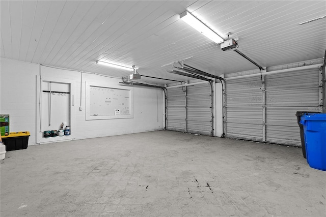 9780 Allen Rd, Lithia, FL 33547 - garage with a garage door opener and concrete block wall