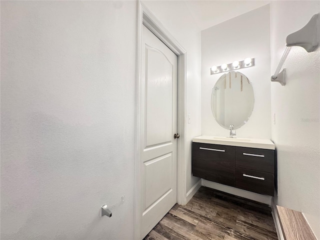 bathroom featuring wood finished floors and vanity