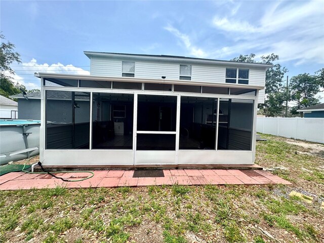 3181 Deltona Blvd, Spring Hill, FL 34606 - back of house featuring a sunroom