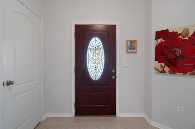 6303 Gentle Ben Cir, Wesley Chapel, FL 33544 - foyer with baseboards and light tile patterned floors