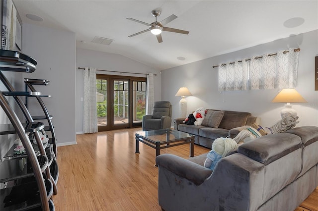 6303 Gentle Ben Cir, Wesley Chapel, FL 33544 - living room with lofted ceiling, ceiling fan, light wood-style floors, and baseboards