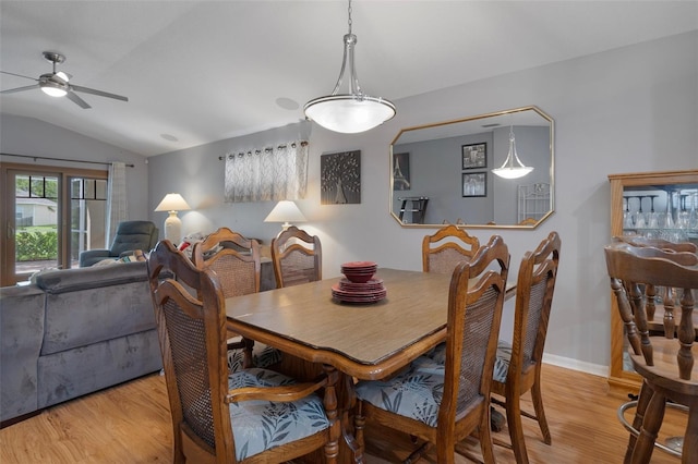 6303 Gentle Ben Cir, Wesley Chapel, FL 33544 - dining space with a ceiling fan, light wood-style flooring, vaulted ceiling, and baseboards