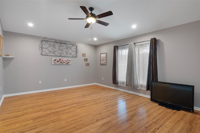 6303 Gentle Ben Cir, Wesley Chapel, FL 33544 - empty room with a ceiling fan, light wood-type flooring, baseboards, and recessed lighting