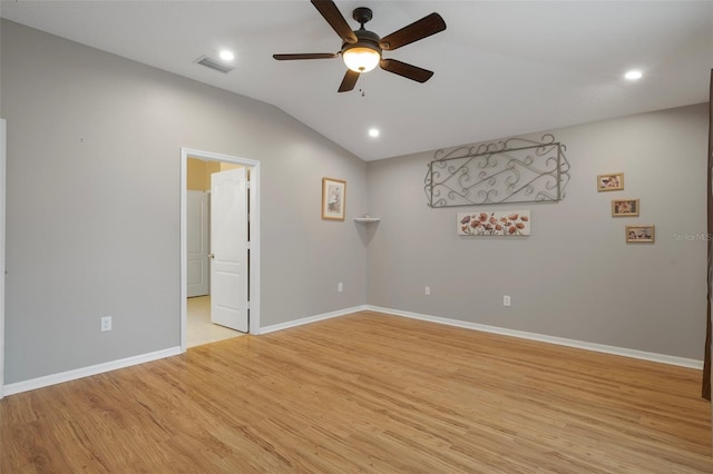 6303 Gentle Ben Cir, Wesley Chapel, FL 33544 - spare room featuring a ceiling fan, vaulted ceiling, light wood finished floors, baseboards, and recessed lighting
