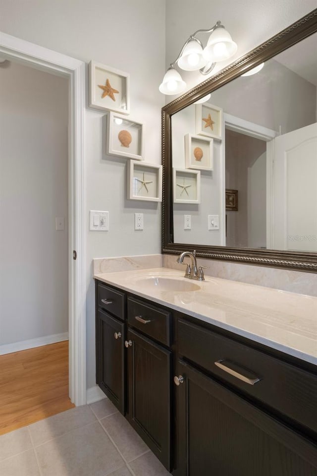 6303 Gentle Ben Cir, Wesley Chapel, FL 33544 - bathroom featuring vanity, tile patterned flooring, and baseboards