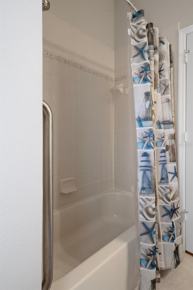 6303 Gentle Ben Cir, Wesley Chapel, FL 33544 - bathroom with shower / bath combo with shower curtain