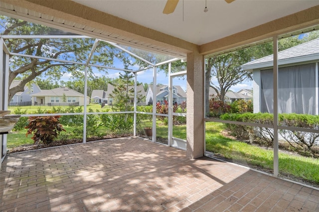6303 Gentle Ben Cir, Wesley Chapel, FL 33544 - unfurnished sunroom featuring a residential view and ceiling fan