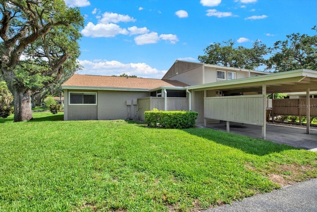 8630 Cattail Dr Unit 8630, Temple Terrace, FL 33637 - view of side of home with a carport and stucco siding