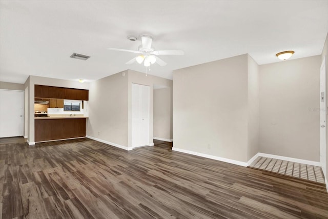 8630 Cattail Dr Unit 8630, Temple Terrace, FL 33637 - unfurnished living room with dark wood-type flooring, a ceiling fan, and baseboards