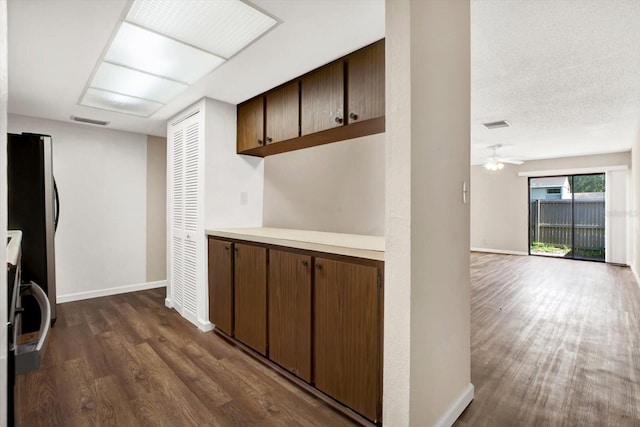 8630 Cattail Dr Unit 8630, Temple Terrace, FL 33637 - kitchen featuring dark wood-style flooring, baseboards, and light countertops