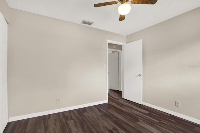 8630 Cattail Dr Unit 8630, Temple Terrace, FL 33637 - spare room featuring dark wood-style flooring, ceiling fan, and baseboards