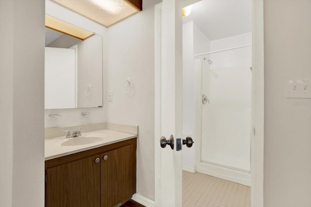 8630 Cattail Dr Unit 8630, Temple Terrace, FL 33637 - full bathroom with a shower stall, vanity, and tile patterned flooring