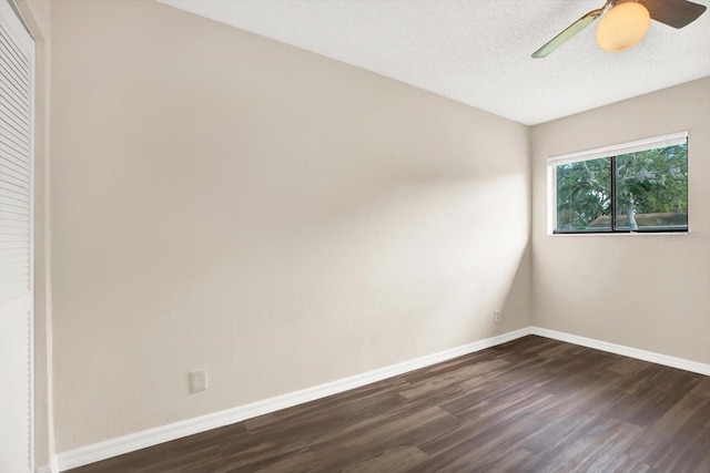 8630 Cattail Dr Unit 8630, Temple Terrace, FL 33637 - empty room with dark wood finished floors, baseboards, ceiling fan, and a textured ceiling