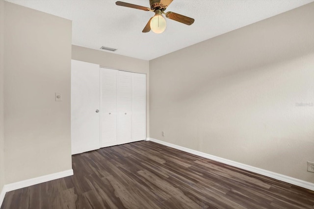 8630 Cattail Dr Unit 8630, Temple Terrace, FL 33637 - unfurnished bedroom with baseboards, wood finished floors, a closet, and a ceiling fan