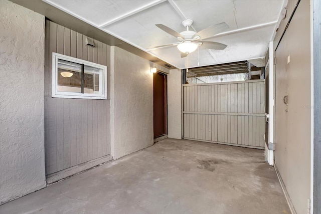 8630 Cattail Dr Unit 8630, Temple Terrace, FL 33637 - garage featuring a textured wall and a ceiling fan