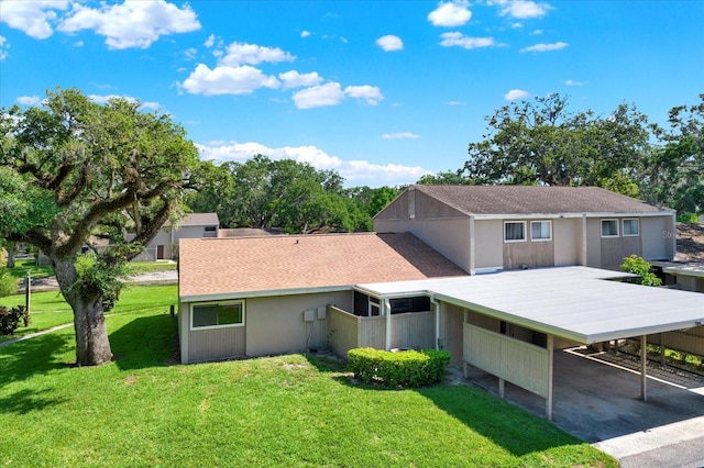 8630 Cattail Dr Unit 8630, Temple Terrace, FL 33637 - view of front of home featuring a front yard and a carport