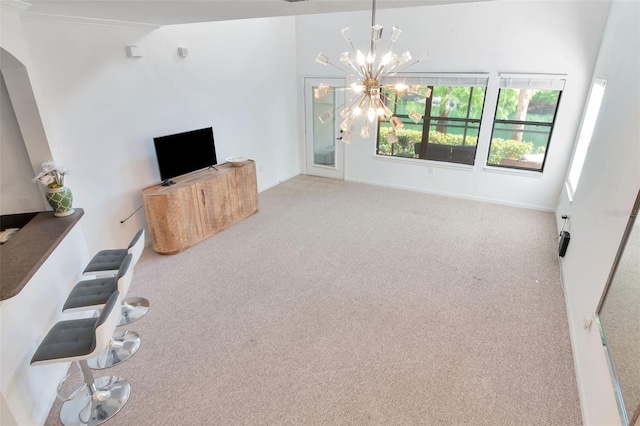 2173 Tuscany Trce Unit 8, Palm Harbor, FL 34683 - unfurnished living room with carpet flooring and a chandelier