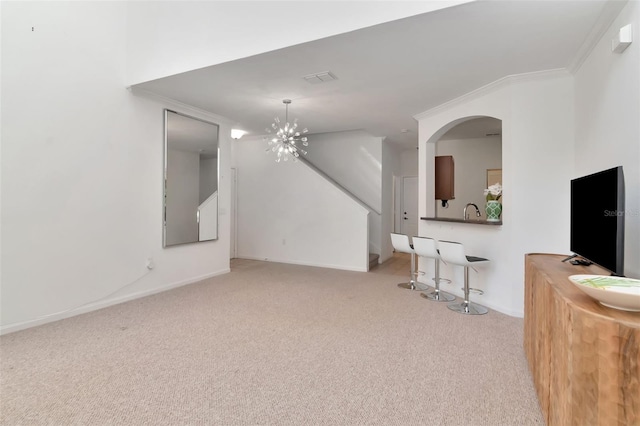 2173 Tuscany Trce Unit 8, Palm Harbor, FL 34683 - unfurnished living room with carpet, a chandelier, baseboards, and arched walkways