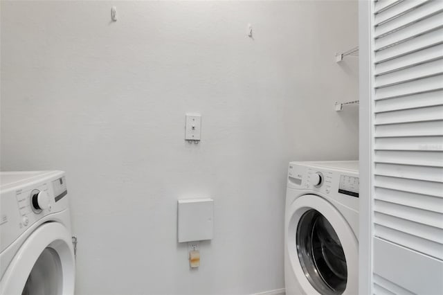 2173 Tuscany Trce Unit 8, Palm Harbor, FL 34683 - washroom with separate washer and dryer
